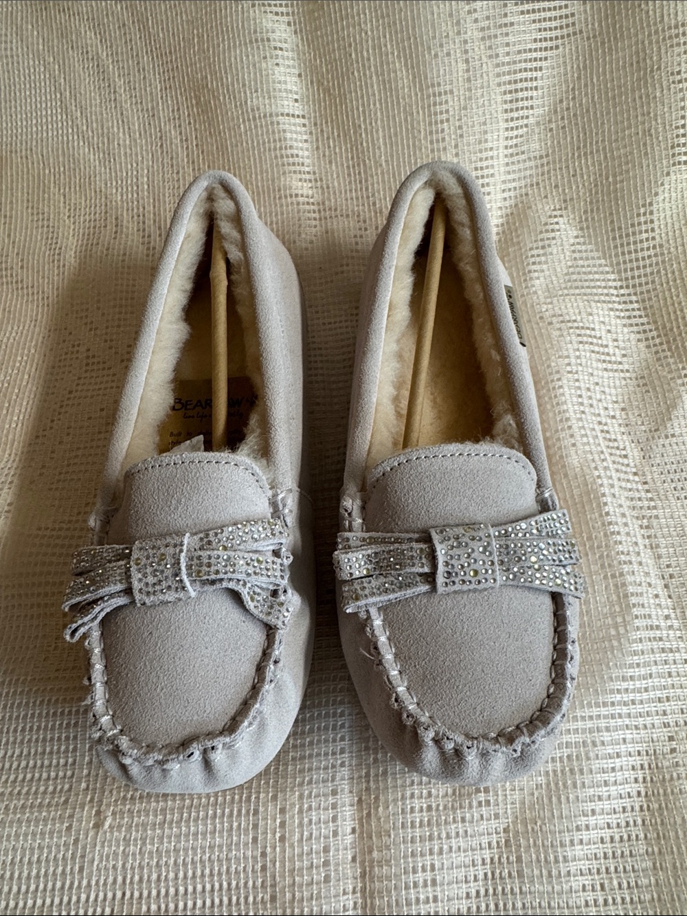 NWT. BearPaw Gray Suede Moccasin with Sheepskin Wool + Rhinestone Bow.Size 10